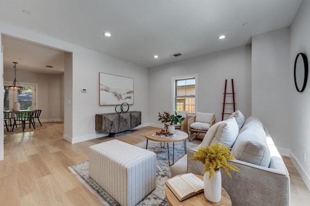 2701 Swanston Oaks, Sacramento, CA 95818 - living room with light wood finished floors, recessed lighting, and baseboards