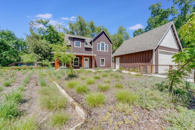 2701 Swanston Oaks, Sacramento, CA 95818 - view of front of property featuring an outdoor structure, a detached garage, and board and batten siding