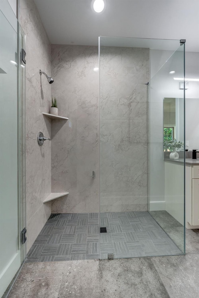full bathroom with vanity and a stall shower