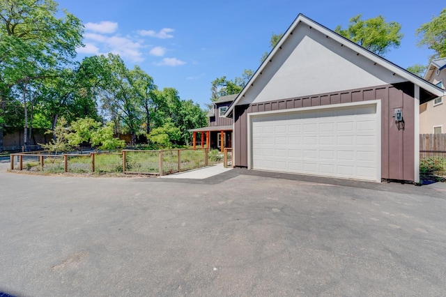 2701 Swanston Oaks, Sacramento, CA 95818 - view of side of home featuring board and batten siding and driveway