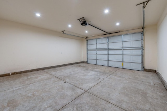 garage with baseboards, recessed lighting, and a garage door opener