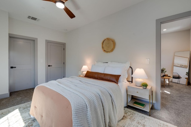 bedroom with visible vents, carpet flooring, and ceiling fan