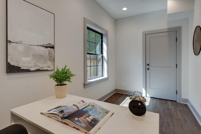 interior space with baseboards, recessed lighting, and dark wood-type flooring