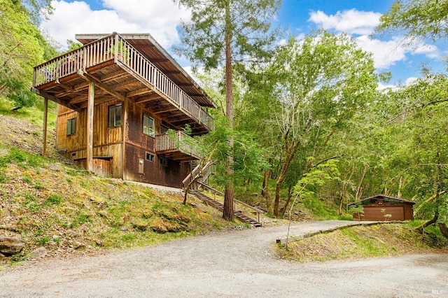 2 Pine Flat Rd, Cazadero, CA 95421 - view of side of home with a wooden deck, dirt driveway, and stairs