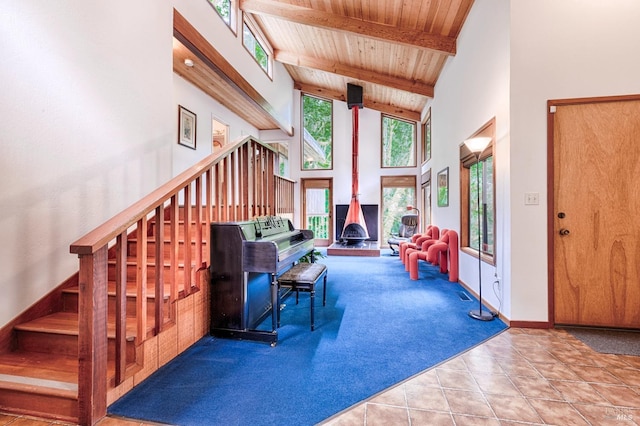 2 Pine Flat Rd, Cazadero, CA 95421 - carpeted living area with tile patterned floors, beam ceiling, stairs, wooden ceiling, and high vaulted ceiling