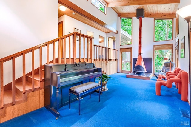 2 Pine Flat Rd, Cazadero, CA 95421 - sitting room featuring carpet floors, beam ceiling, a towering ceiling, and a healthy amount of sunlight