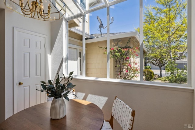 dining area with an inviting chandelier