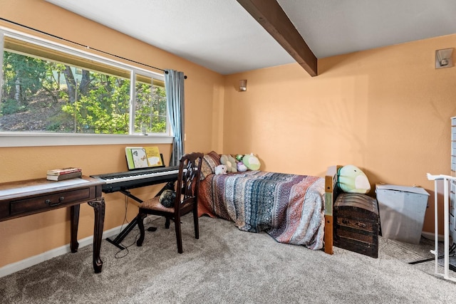 carpeted bedroom with baseboards and beam ceiling
