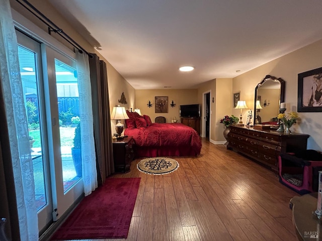 bedroom with recessed lighting and wood-type flooring