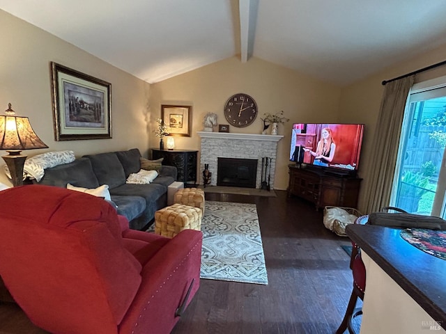 living room featuring a fireplace with flush hearth, wood finished floors, and vaulted ceiling with beams