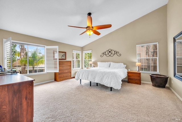 bedroom featuring baseboards, ceiling fan, light carpet, and lofted ceiling