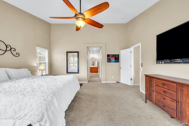 4575 Avondale Cir, Fairfield, CA 94533 - bedroom featuring light colored carpet, high vaulted ceiling, baseboards, ceiling fan, and ensuite bath