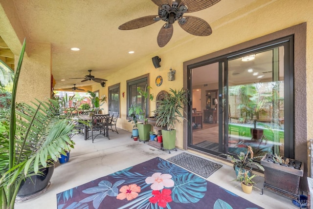 view of patio with ceiling fan and outdoor dining space