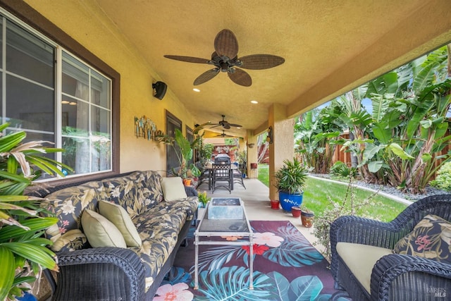 view of patio / terrace with outdoor dining space, a ceiling fan, outdoor lounge area, and fence private yard