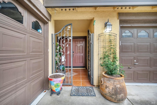 property entrance with stucco siding and a porch