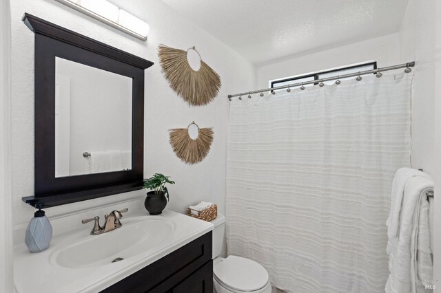 unfurnished room with baseboards, wood finished floors, and visible vents