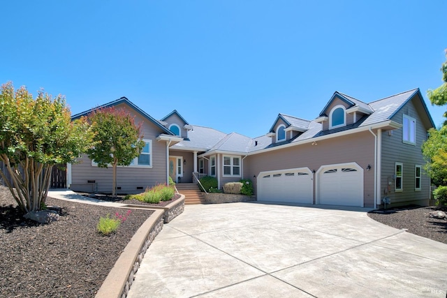 view of front of property with a garage and concrete driveway