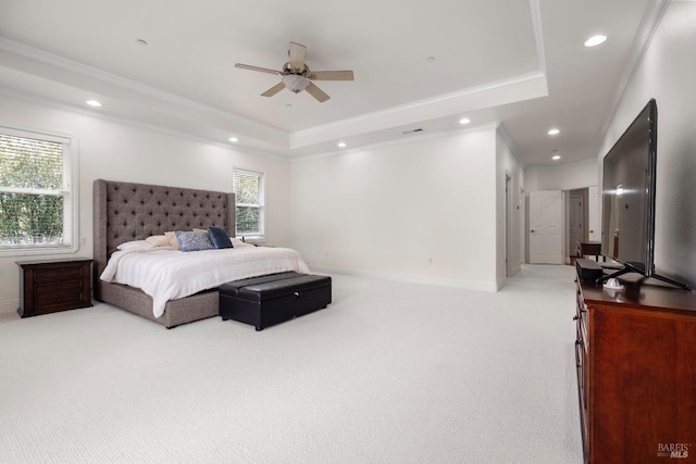 bedroom featuring carpet floors, crown molding, a tray ceiling, and recessed lighting