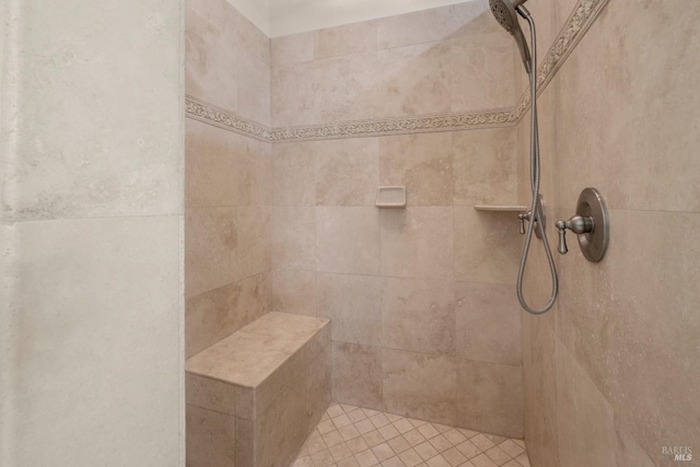 full bath featuring a tile shower