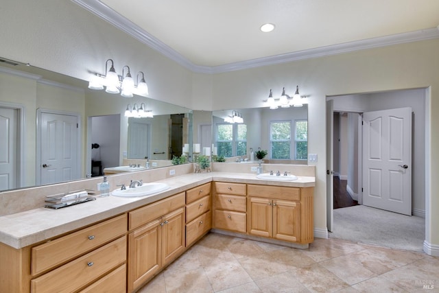 bathroom featuring double vanity, visible vents, a sink, and ornamental molding