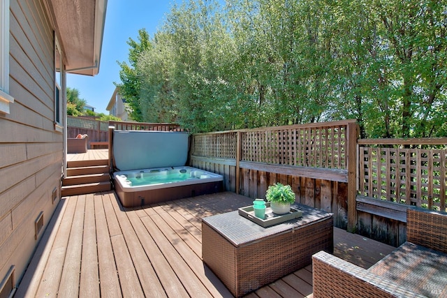 deck with a covered hot tub