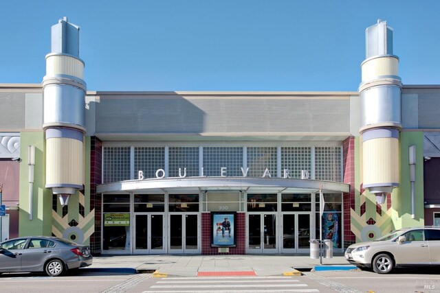 view of building exterior featuring uncovered parking