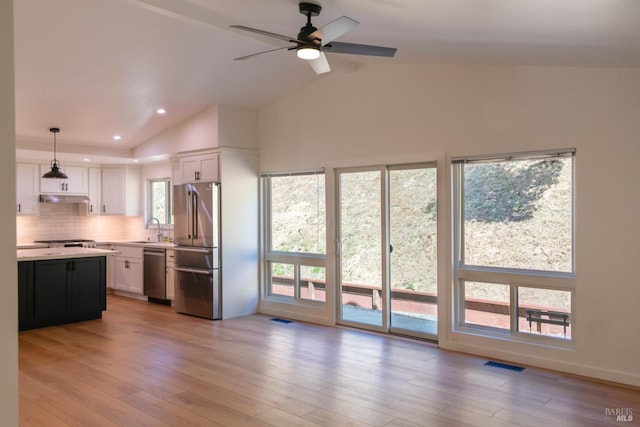 8 Shon Ct, Novato, CA 94947 - kitchen featuring stainless steel appliances, light countertops, white cabinetry, under cabinet range hood, and a sink