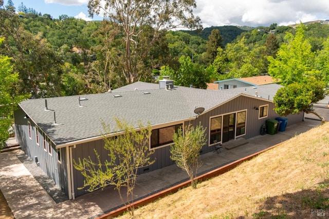 8 Shon Ct, Novato, CA 94947 - rear view of property with roof with shingles and a forest view