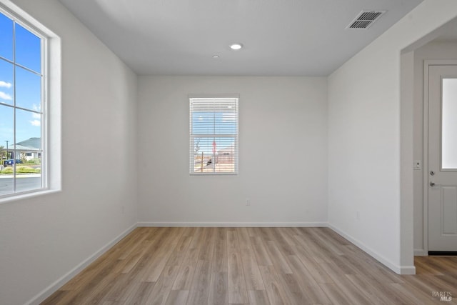 unfurnished room featuring baseboards, visible vents, recessed lighting, and light wood-style floors