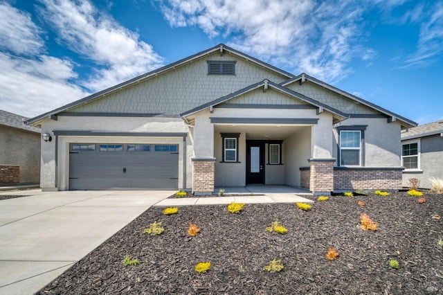 craftsman-style home with an attached garage, concrete driveway, brick siding, and stucco siding
