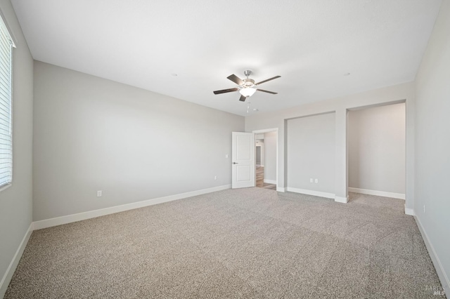 unfurnished bedroom featuring a ceiling fan, baseboards, and carpet floors