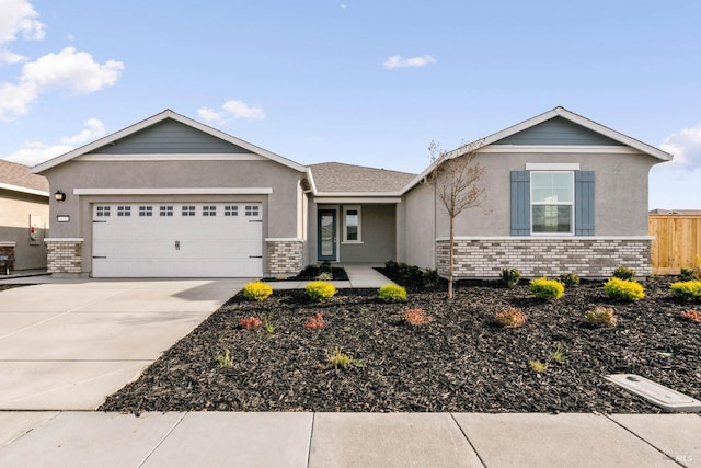 ranch-style home with stucco siding, concrete driveway, and a garage
