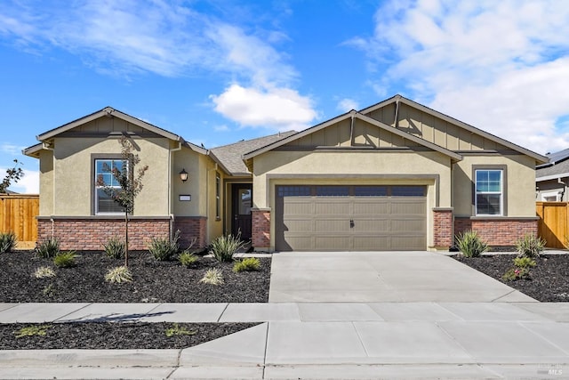 craftsman-style home with brick siding, stucco siding, a garage, and fence