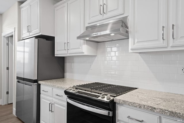 kitchen with decorative backsplash, stainless steel appliances, white cabinets, under cabinet range hood, and light stone countertops