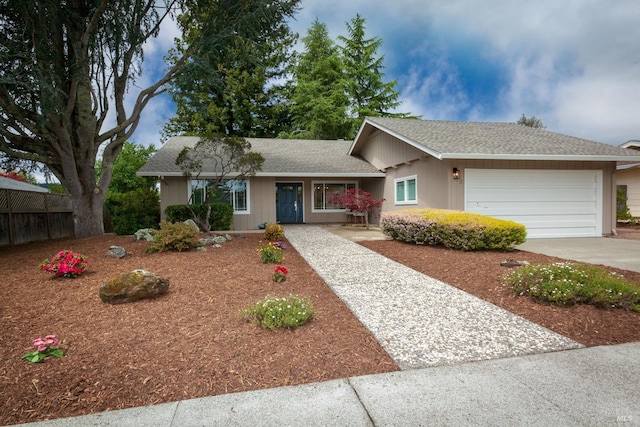 single story home featuring driveway, fence, a shingled roof, and a garage