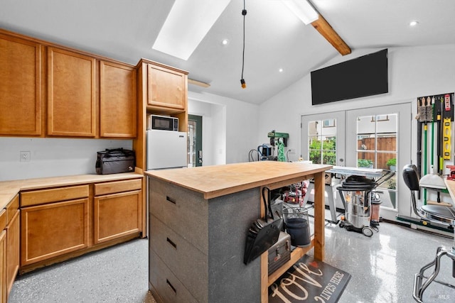 kitchen featuring recessed lighting, brown cabinets, vaulted ceiling with beams, black microwave, and wooden counters