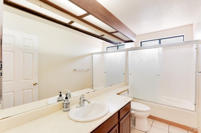 full bathroom with toilet, tile patterned floors, enclosed tub / shower combo, and vanity