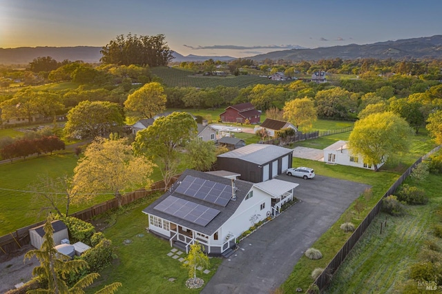 birds eye view of property featuring a mountain view