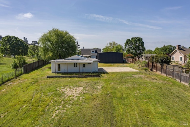 view of yard with a fenced backyard and a patio area