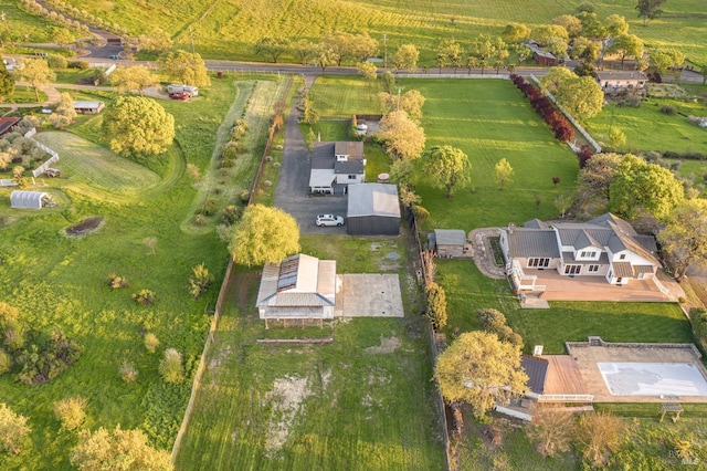 birds eye view of property featuring a rural view