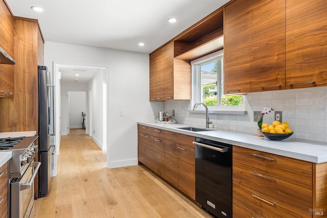 kitchen with stainless steel appliances, brown cabinets, modern cabinets, and a sink