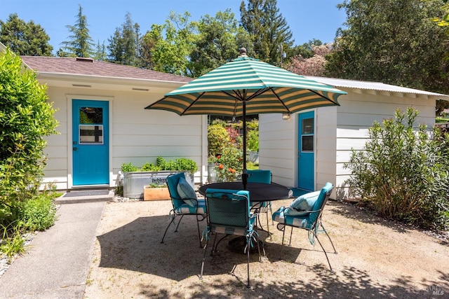 view of patio featuring outdoor dining area