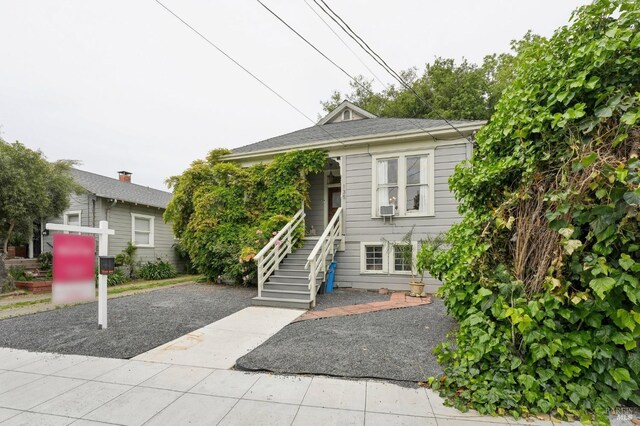 bungalow-style home featuring stairway