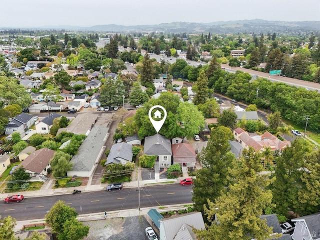 birds eye view of property featuring a residential view and a mountain view