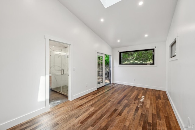 unfurnished bedroom with a skylight, access to outside, hardwood / wood-style flooring, and recessed lighting