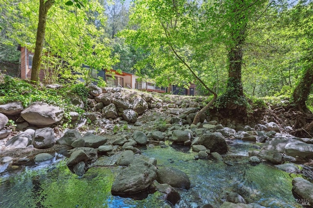view of landscape with a forest view