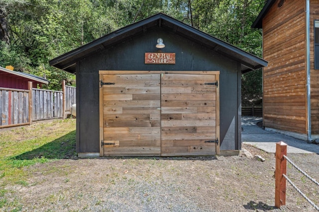 view of shed with fence