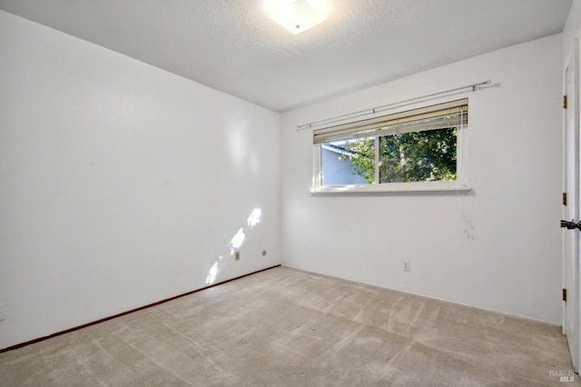 unfurnished room with carpet