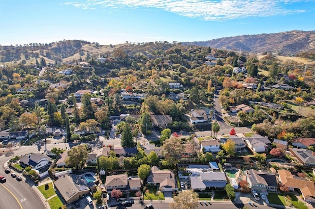drone / aerial view featuring a residential view and a mountain view