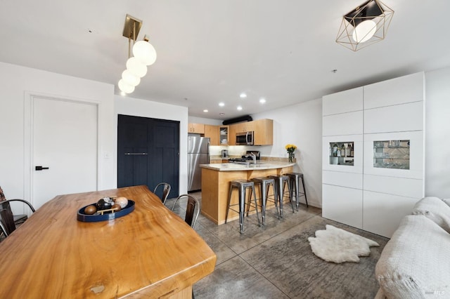 dining space featuring recessed lighting and baseboards